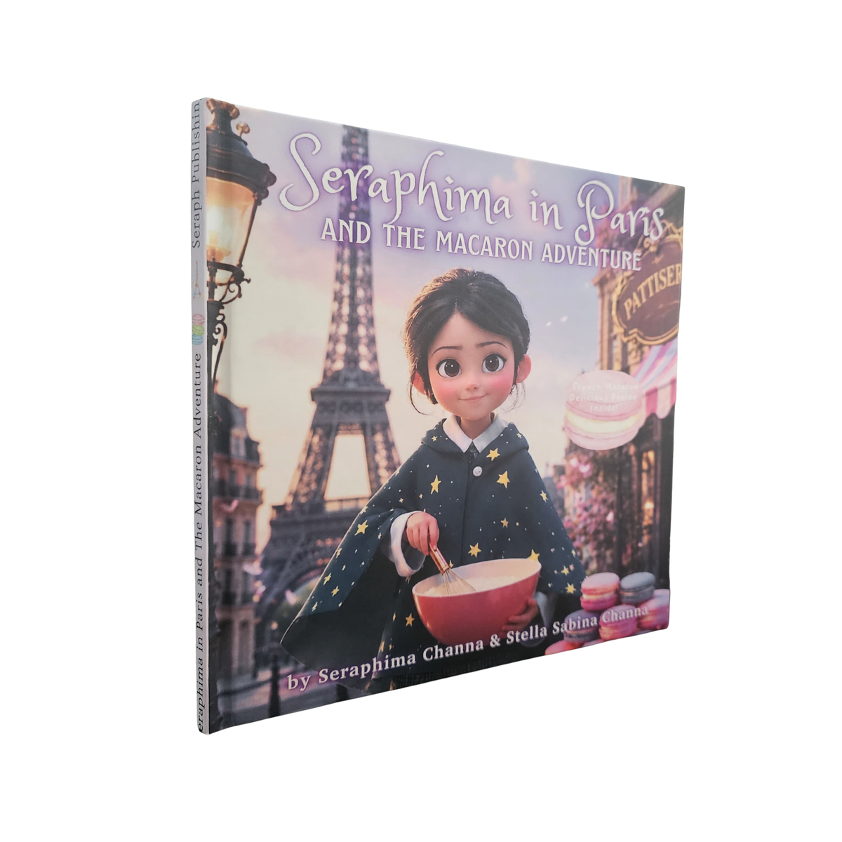 Children's book titled 'Seraphima in Paris and the Macaron Adventure' shown at a slight angle, featuring an illustrated cover with the Eiffel Tower, a girl in a starry outfit, and macarons on a light gray background.